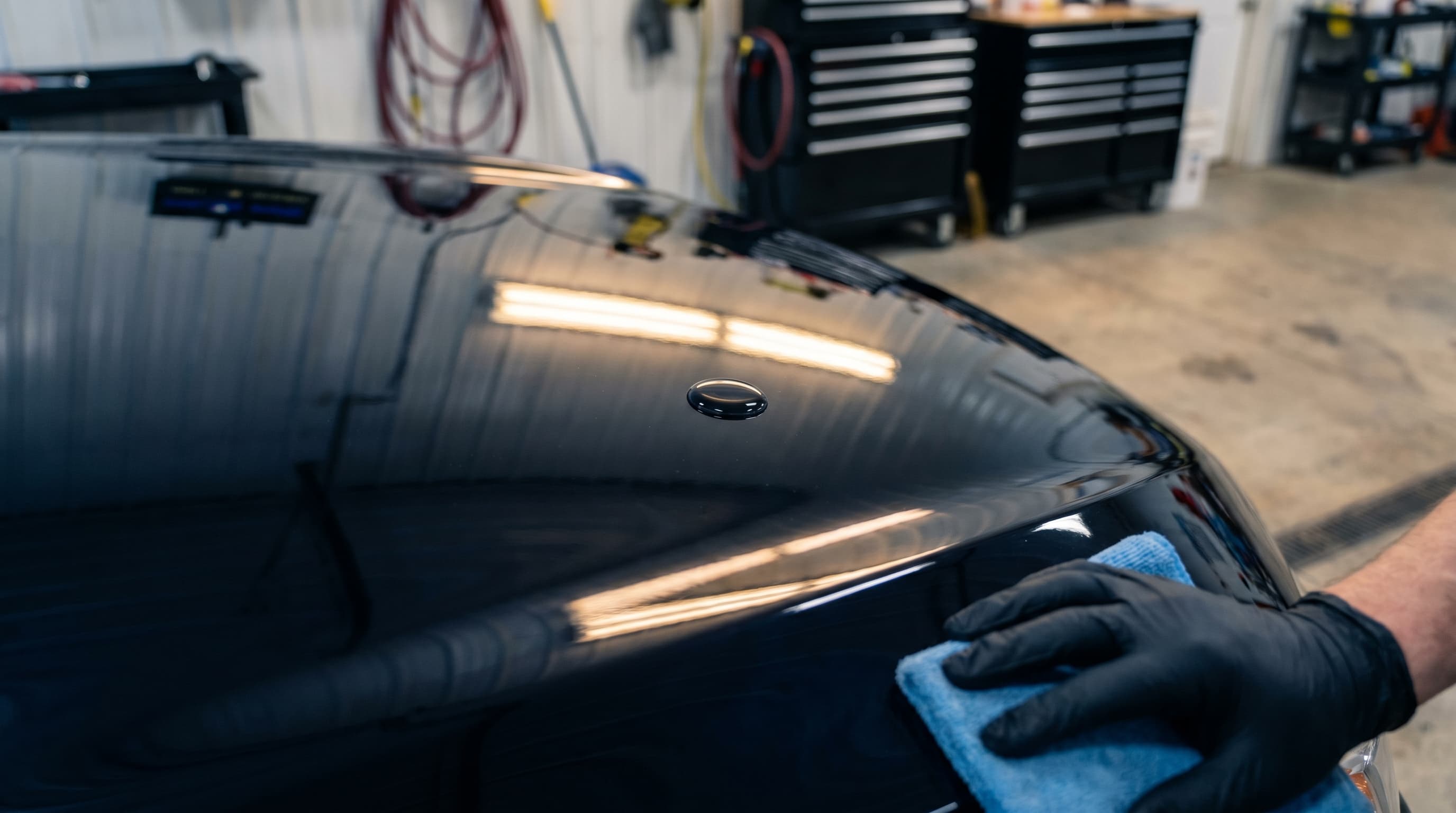 Ceramic-coated black paint with hydrophobic water beads at AJR PDR Hudson WI