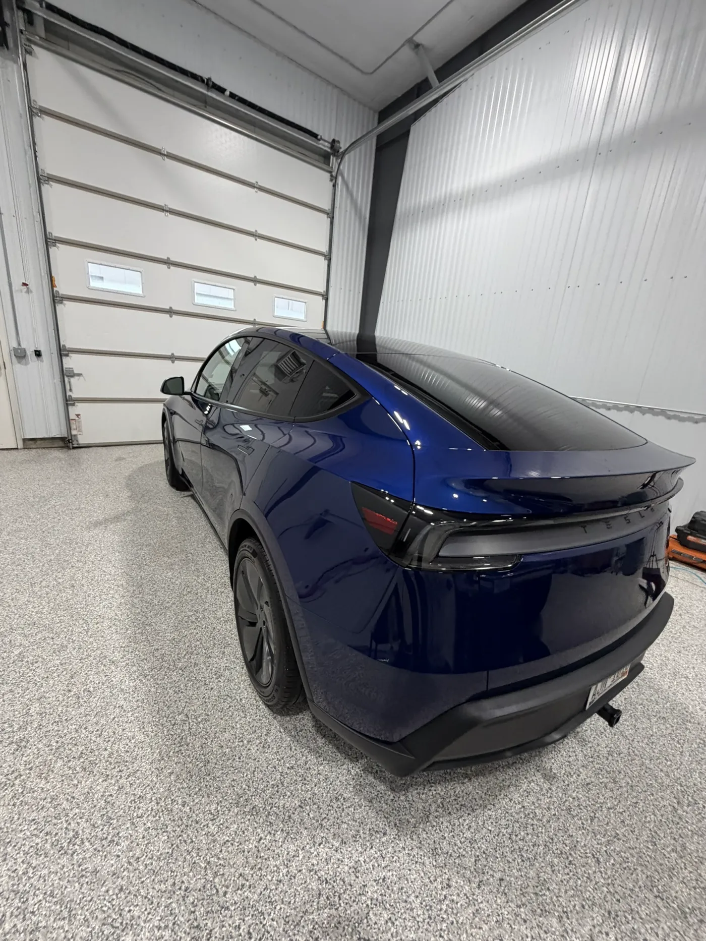 Blue Tesla after a 7-year ceramic coating install in River Falls, WI