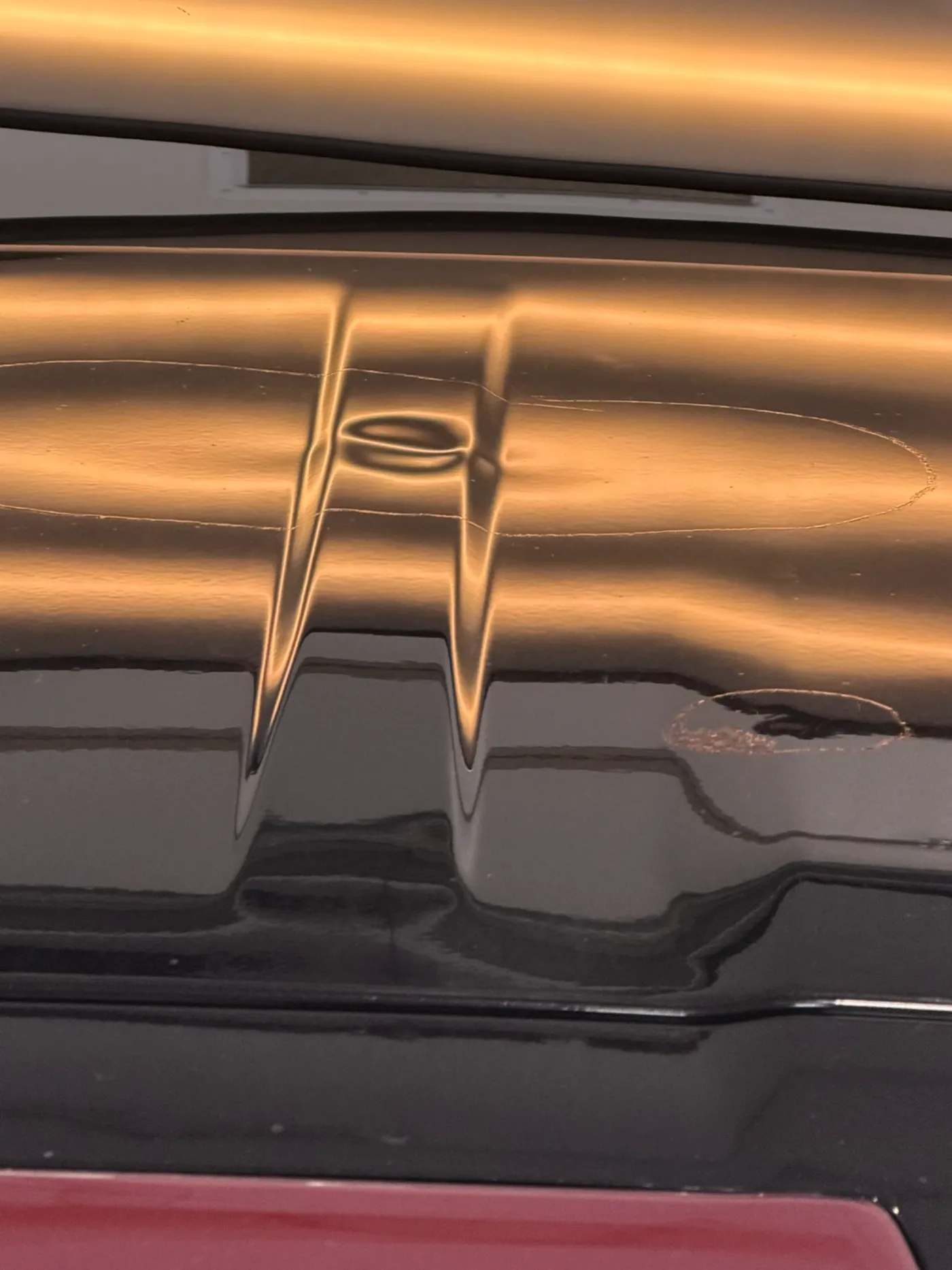 Paintless dent repair work — applied to hail damage on roof and hood panels