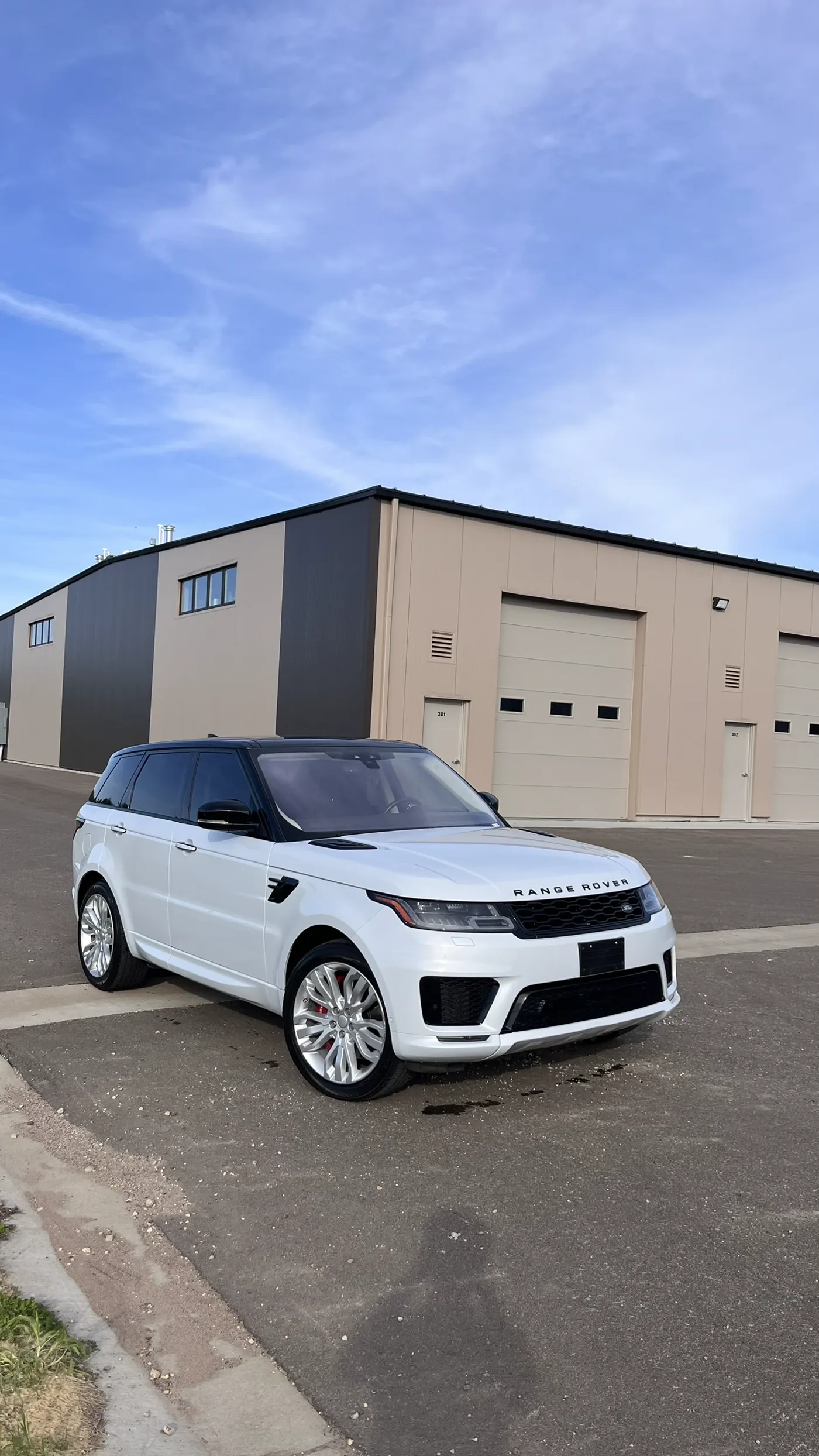 White Range Rover with ceramic window tint installed cleanly in River Falls, WI